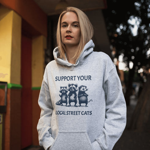 Nothing says “community support” like two raccoons and a possum banding together for the greater good (or maybe just snacks).